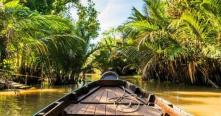 Pagayer en long de canaux sous les cocotiers Croisiere au delta du Mekong